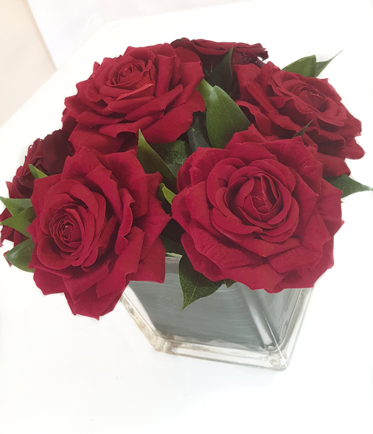 Artificial Red Roses In Clear Vase with Aspidistra