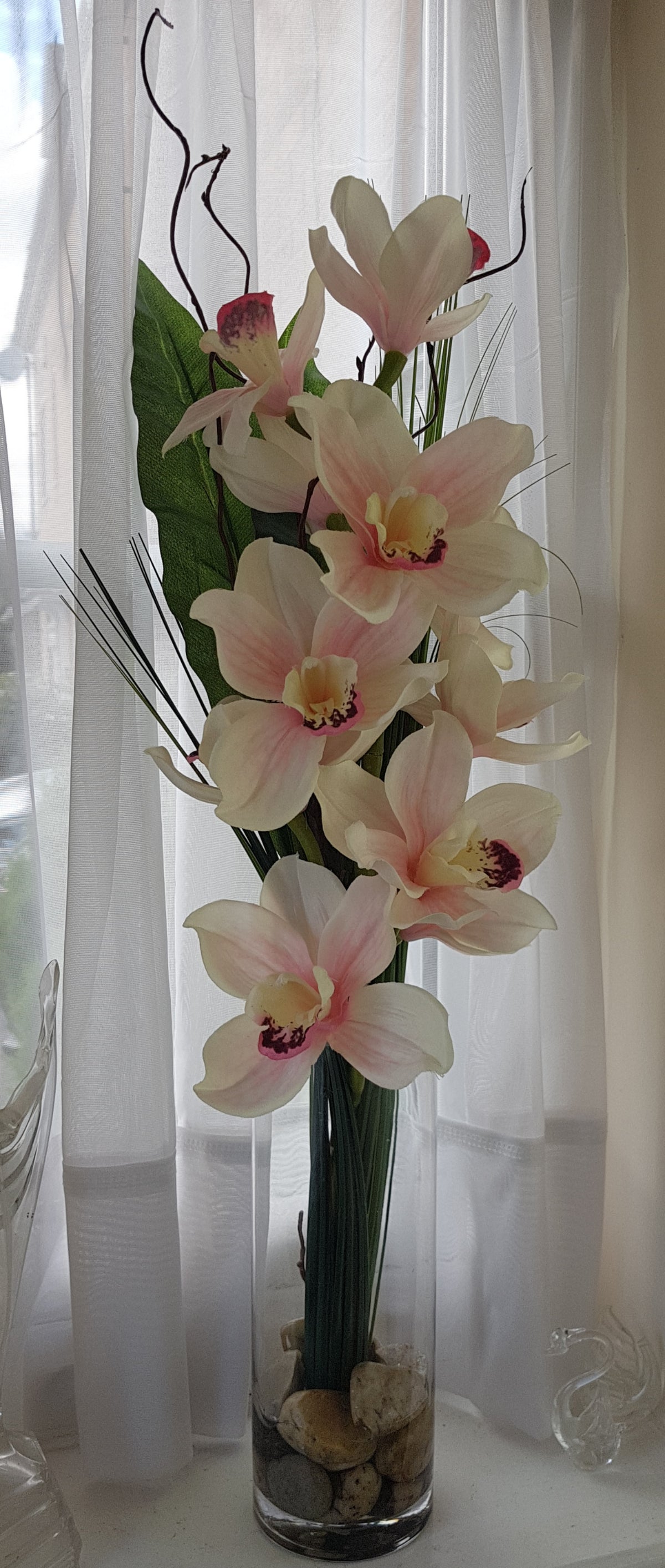 Cymbidium Orchid Faux Flowers in Tall Cylinder Vase